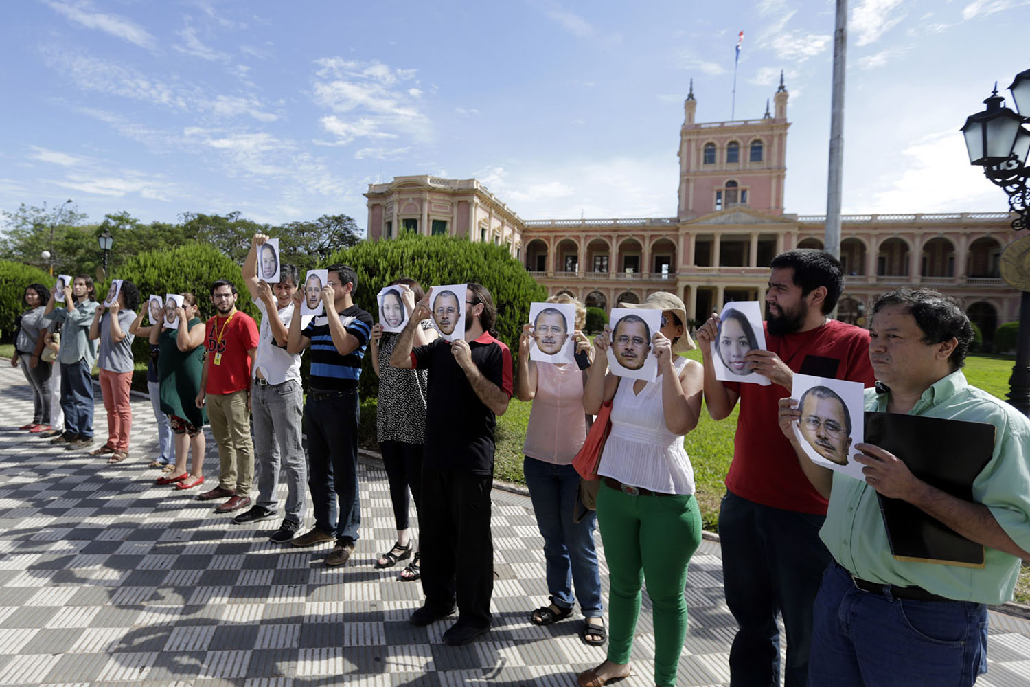 Paraguayan journalists participate in a demonstration in front of the presidential palace as they demand for a thorough investigation into the assassination of their colleagues, in Asuncion